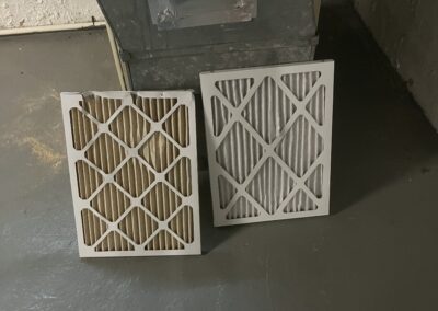 Dirty HVAC vent filter next to a clean one
